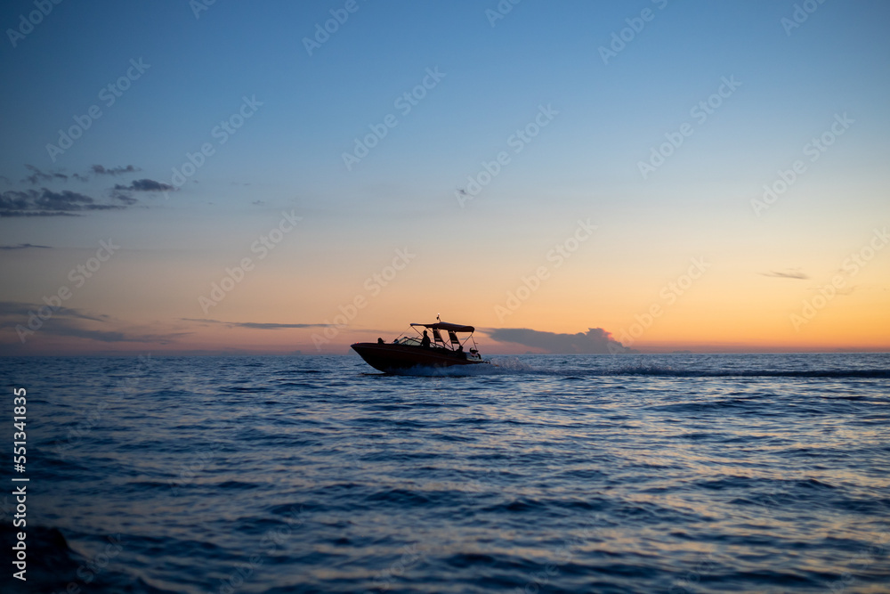 motorboat silhouette racing into the sunset motorboat silhouette racing into the sunset