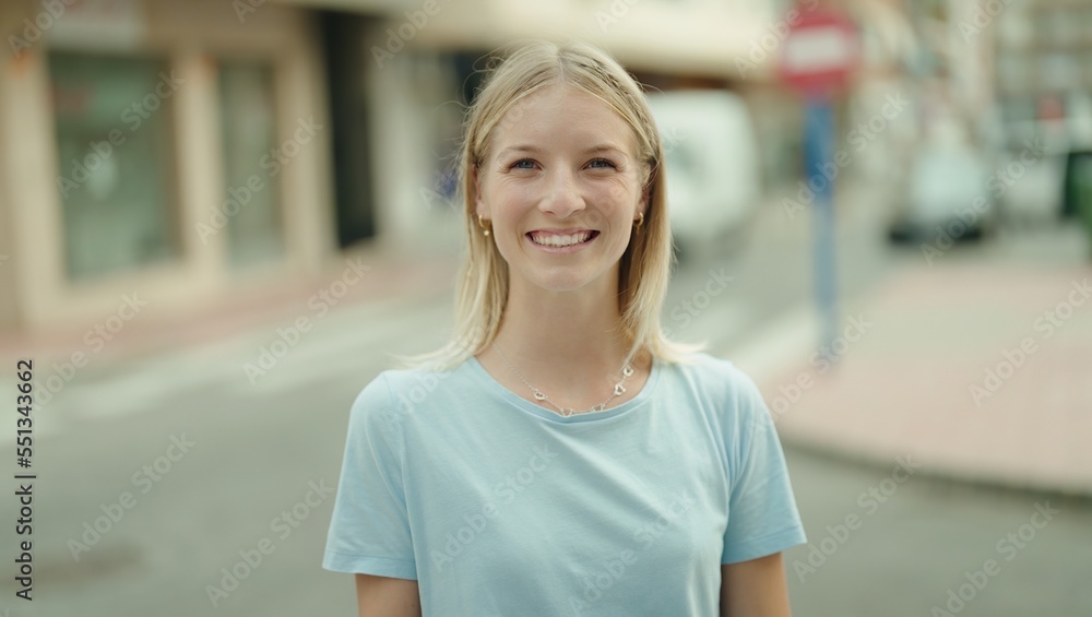 Young blonde woman smiling confident standing at street Young blonde woman smiling confident standing at street