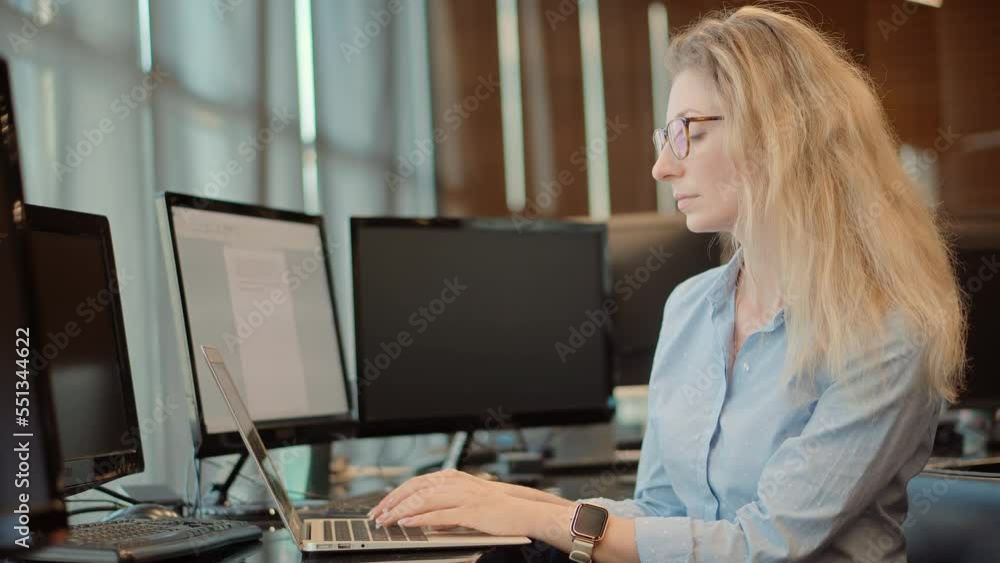 Businesswoman working on laptop in office Businesswoman working on laptop in office