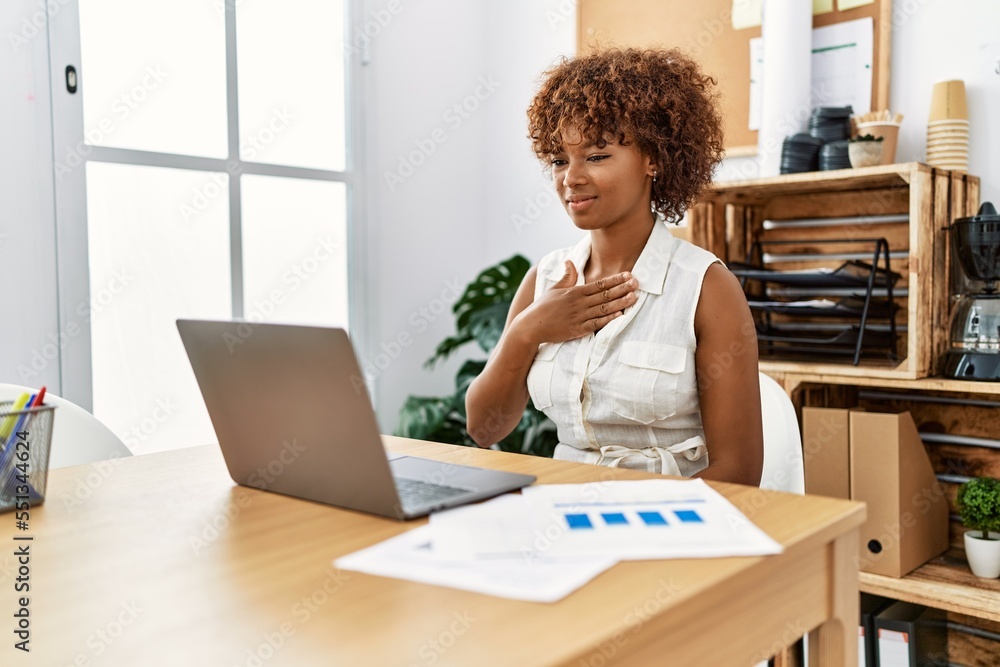 Young african american woman having video call using deaf language at office Young african american woman having video call using deaf language at office