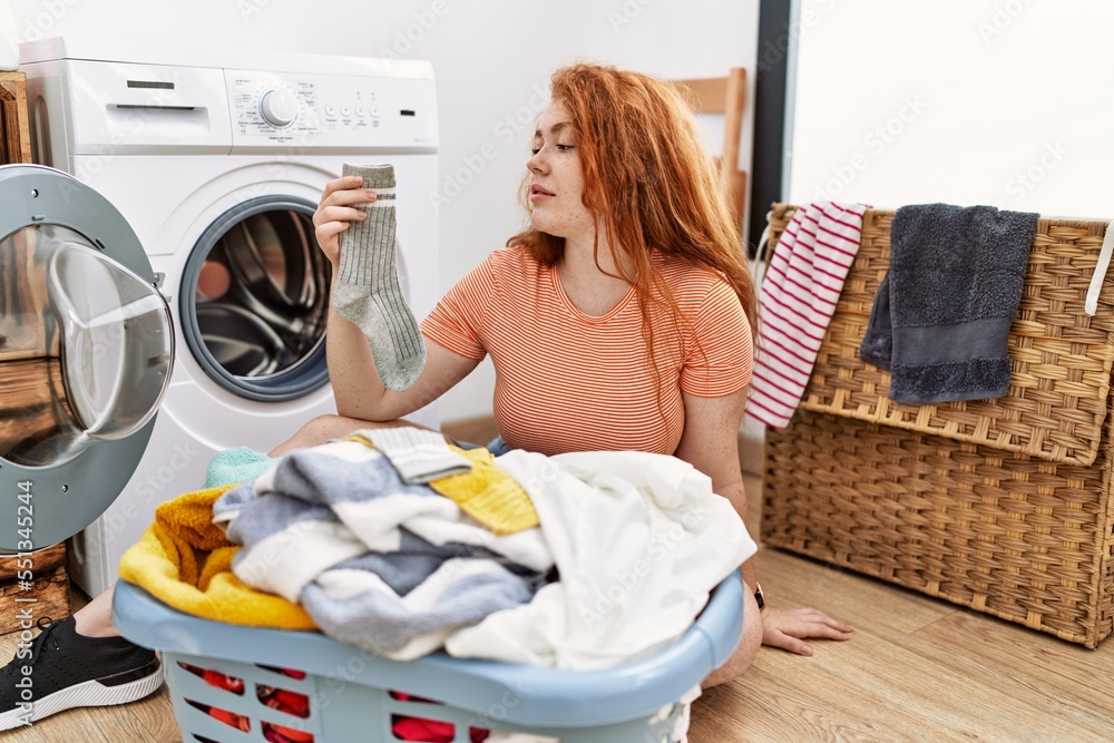 Babe Redhead Woman Putting Dirty Laundry Into Washing Machine Looking To Side Relax Profile