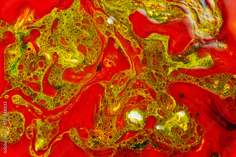 Fluid art colorful abstract background. Red-green stains of paint on liquid