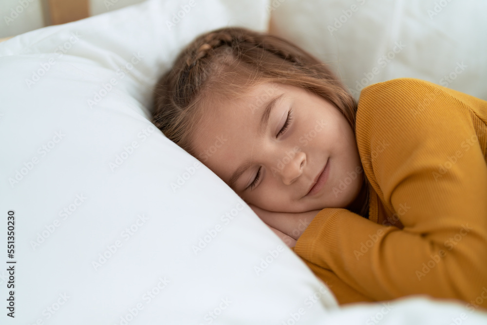 Adorable hispanic girl lying on bed sleeping at bedroom Adorable hispanic girl lying on bed sleeping at bedroom