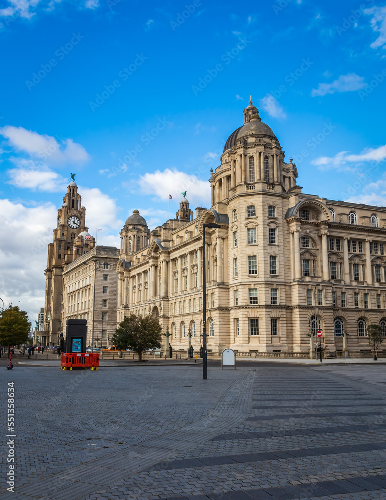 Liverpool, England. The Three Graces' part of Liverpool Maritime Mercantile City. On the left is the Royal Liver Building, in the centre is the Cunard Building Liverpool, England. The Three Graces' part of Liverpool Maritime Mercantile City. On the left is the Royal Liver Building, in the centre is the Cunard Building