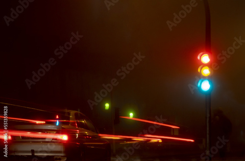traffic lights at night with car light trail