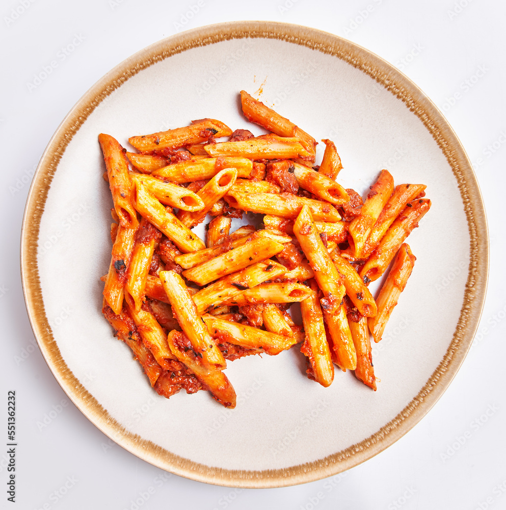  Delicious plate of italian macaroni with tomato sauce over isolated white background