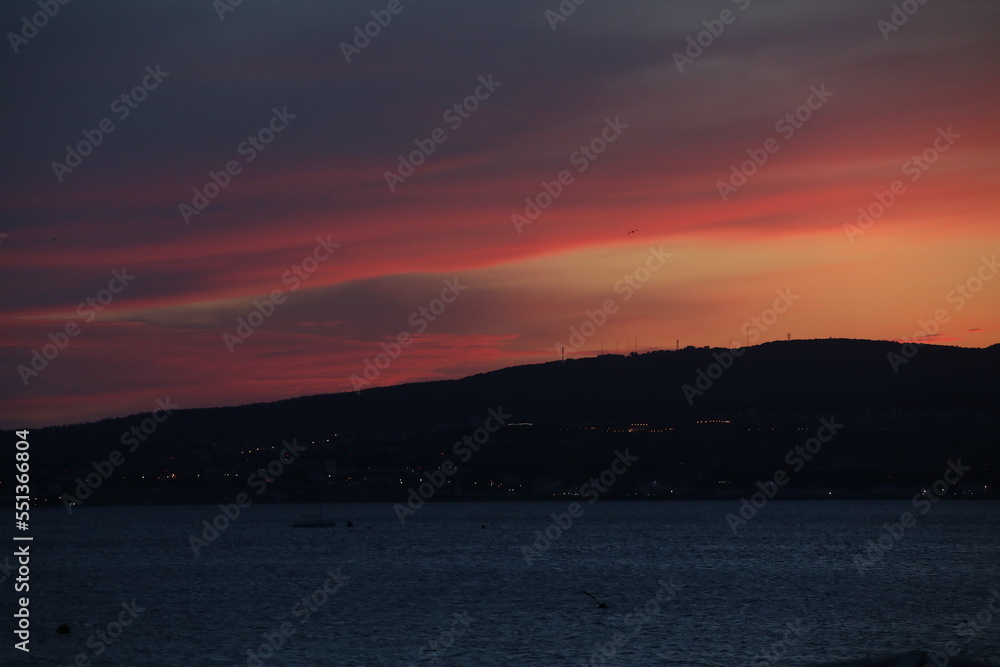 View of the night mountain under the colorful sunset sky