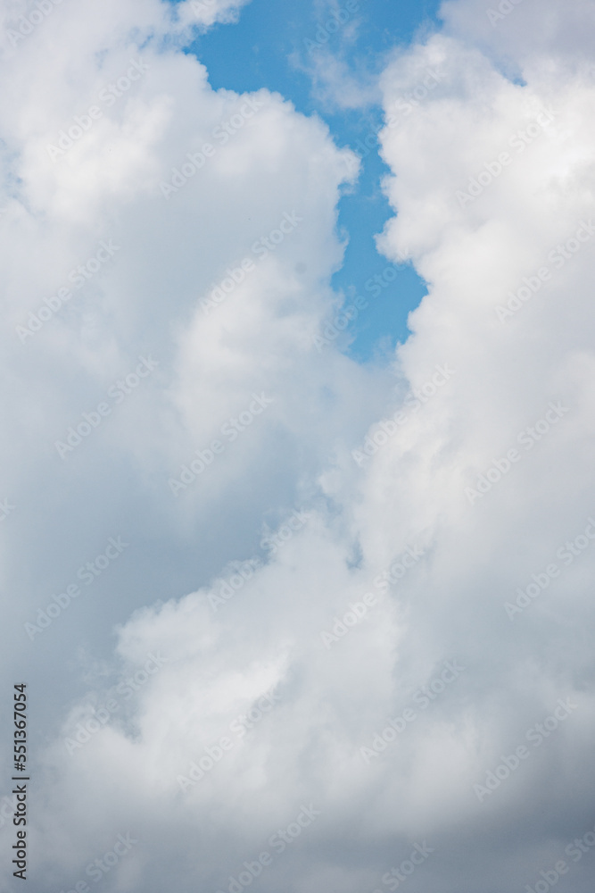 white cumulus clouds against a blue sky, beautiful large thunderclouds in the sky. background of nature. freedom and flight above the earth among the clouds, a dream and a desire. place for white cumulus clouds against a blue sky, beautiful large thunderclouds in the sky. background of nature. freedom and flight above the earth among the clouds, a dream and a desire. place for