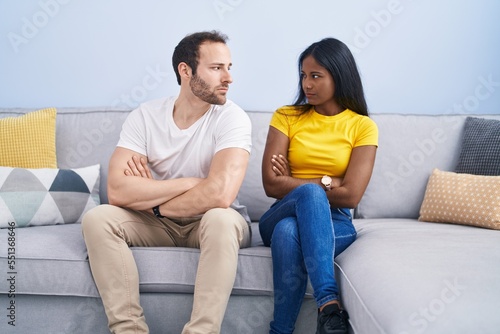 Man and woman interracial couple arguing at home