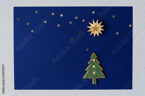 Christmas background with xmas tree and stars, Merry christmas card with blank space for text / wishes, winter holiday theme, Happy New Year. 