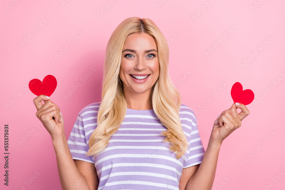 Photo of satisfied lady cute hold little red paper love symbols enjoy her boyfriend valentine day february holiday isolated on pink color background Photo of satisfied lady cute hold little red paper love symbols enjoy her boyfriend valentine day february holiday isolated on pink color background