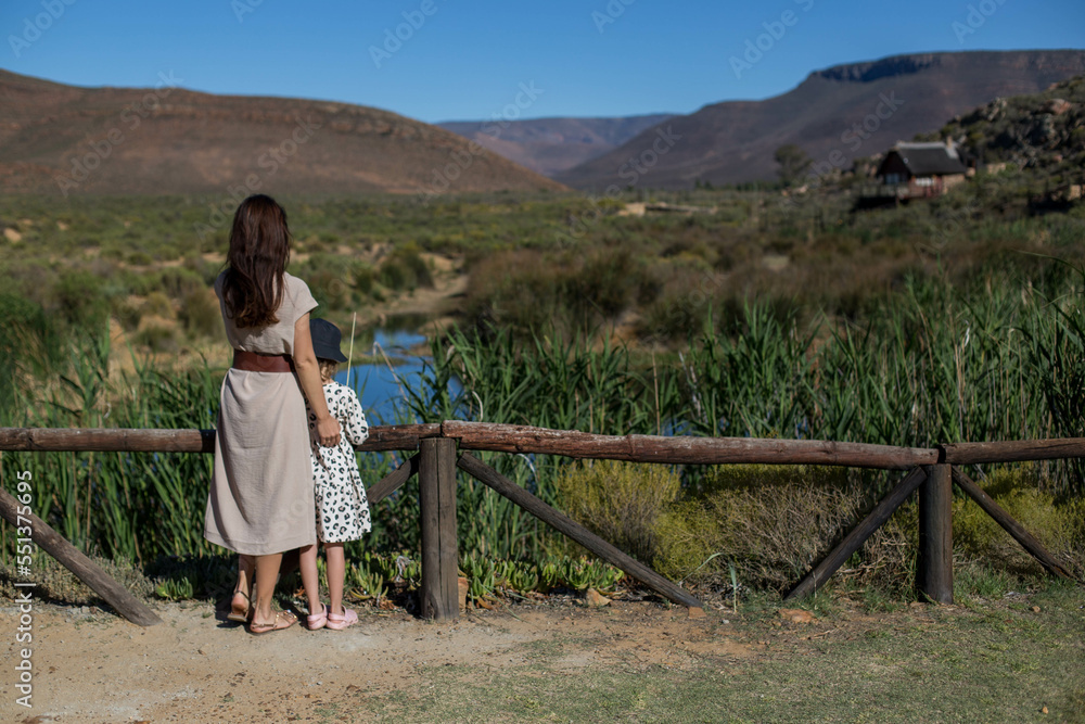 Mom and daughter look at the African owl . South Africa