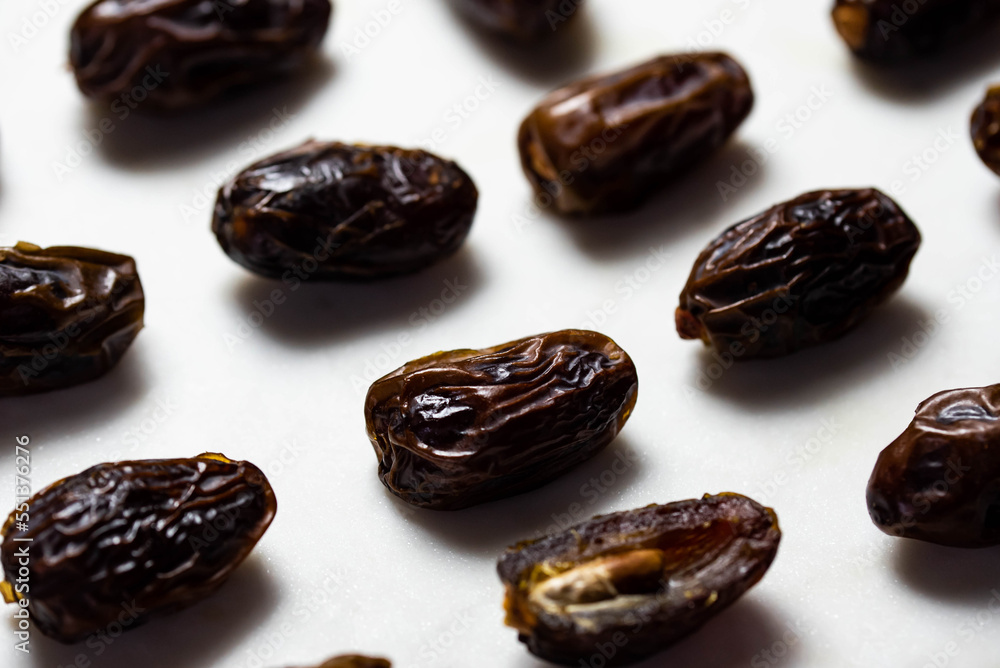 Obraz premium Dates fruit pattern on white background. Dried organic Superfood.