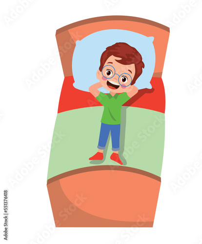 cute boy daydreaming lying on his bed