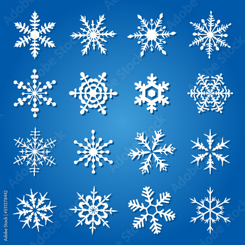 Flat snowflakes, icons isolated on a blue background.
