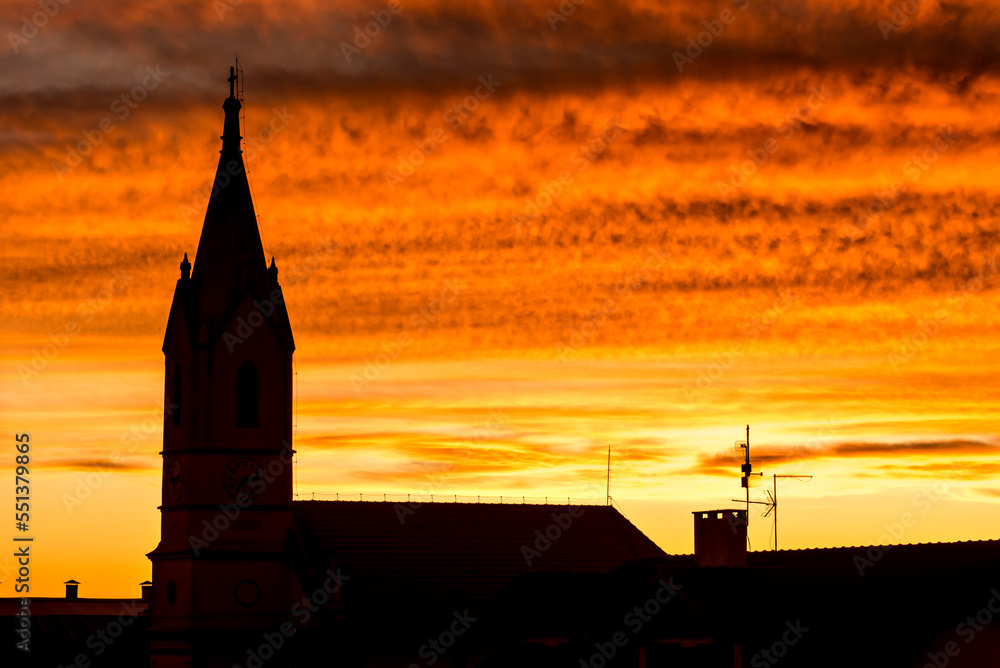 Silhouette of church at red sunset