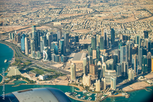 Doha  Qatar - December 12  2016  Aerial view of city skyline from a flying airplane over the Qatar capital