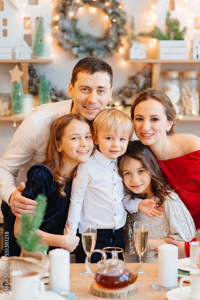 Beautiful big family in the kitchen with Christmas decor. to cook together. Beautiful big family in the kitchen with Christmas decor. to cook together.