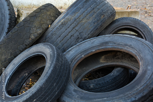 Heap of old truck and car tires with worn treads