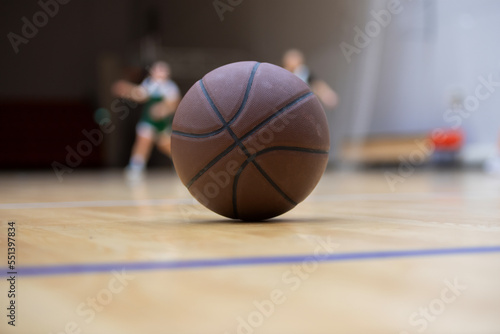 A basketball on the wooden floor as background. Team sport concept © Augustas Cetkauskas