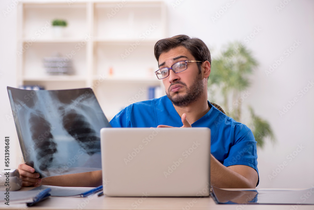 Fototapeta premium Young male doctor radiologist working in the clinic