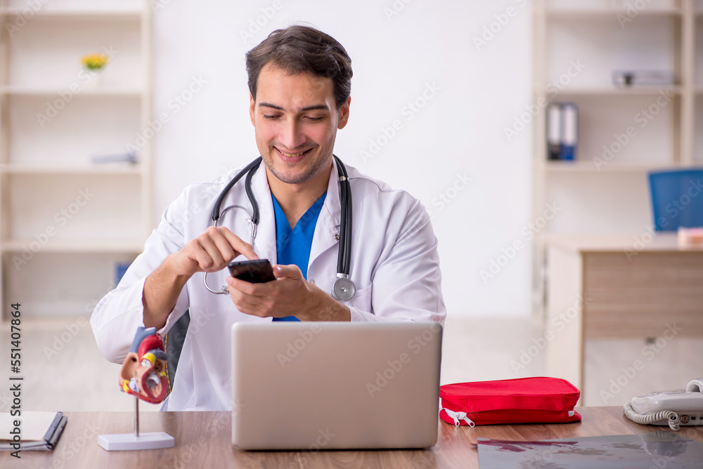 Young male doctor in telemedicine concept Young male doctor in telemedicine concept
