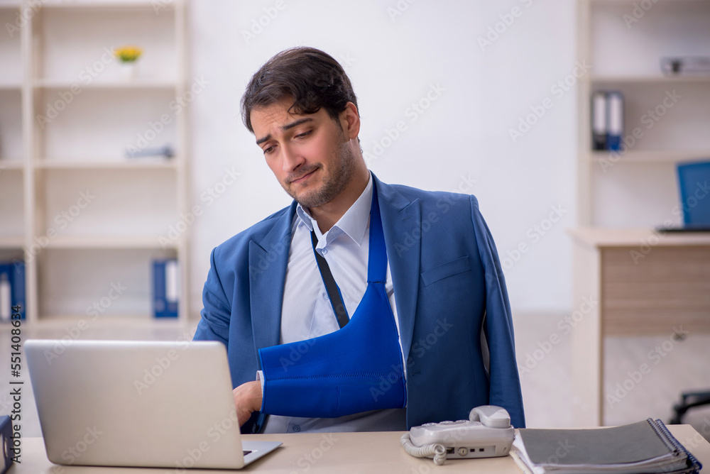 Young male employee after car accident at workplace Young male employee after car accident at workplace
