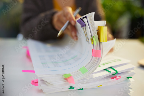 tax time. accountant woman working with documents photo