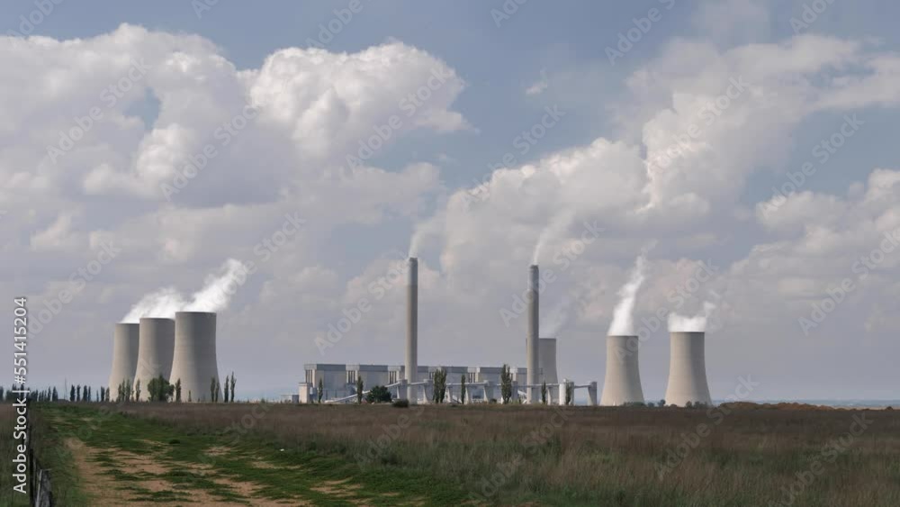Clouds of steam rise from six cooling towers at coal fired power plant Clouds of steam rise from six cooling towers at coal fired power plant