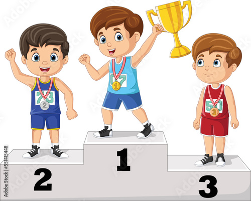 Children with medals standing on podium and holding a trophy