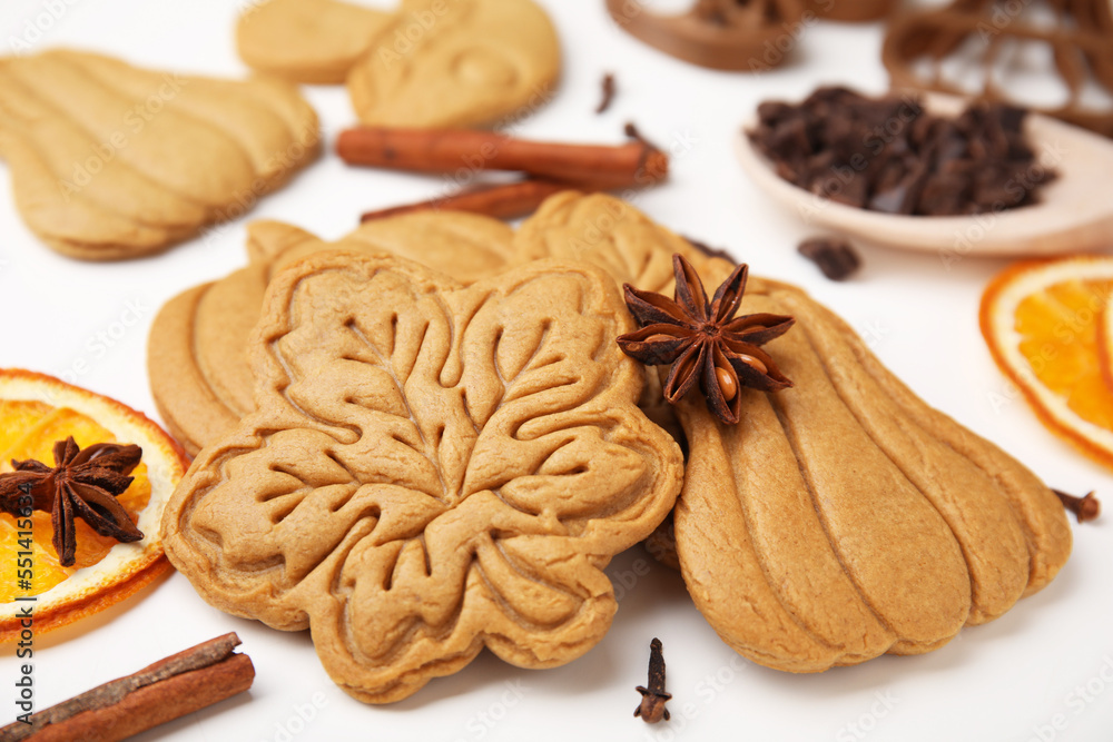 Tasty cookies and spices on white table, closeup Tasty cookies and spices on white table, closeup