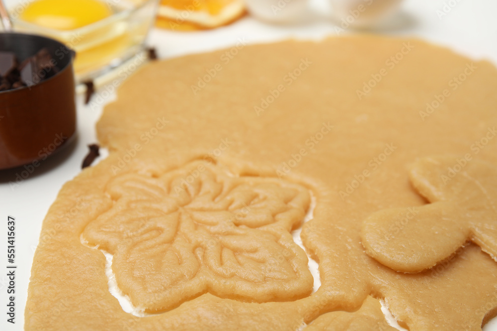 Homemade cookies. Rolled out dough on white table, closeup Homemade cookies. Rolled out dough on white table, closeup