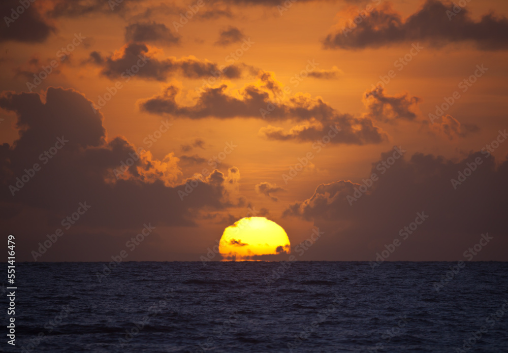 Sun rising over the sea