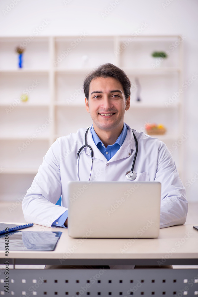 Young male doctor in telemedicine concept Young male doctor in telemedicine concept
