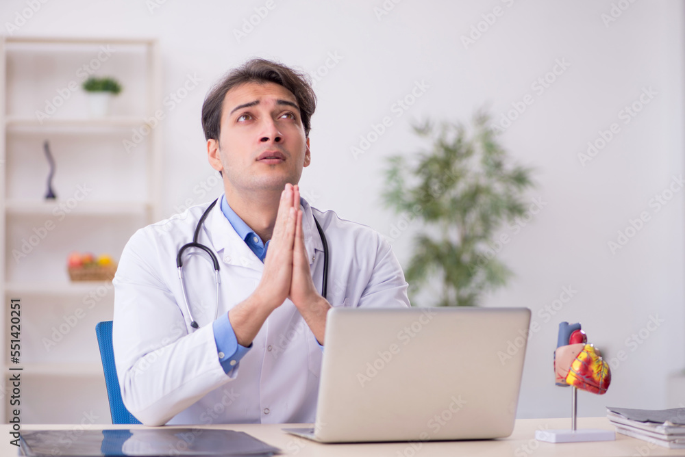 Young male doctor being tired after night shift Young male doctor being tired after night shift