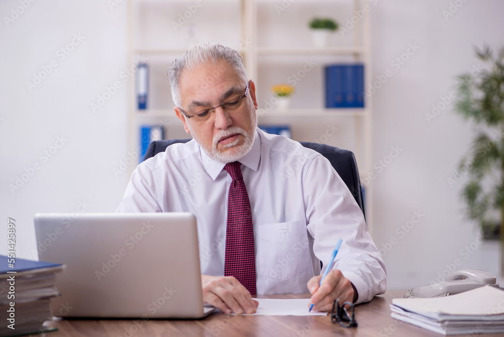 Old male employee and too much work in the office Old male employee and too much work in the office