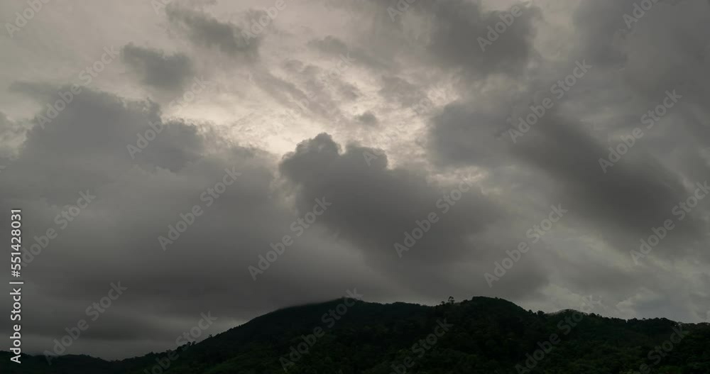 Timelapse footage of Storm clouds and fog over mountains in bad weather ...