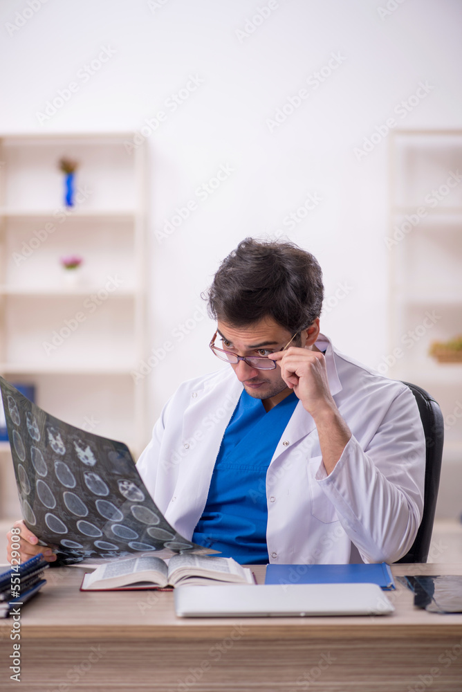 Young male doctor radiologist working in the clinic Young male doctor radiologist working in the clinic