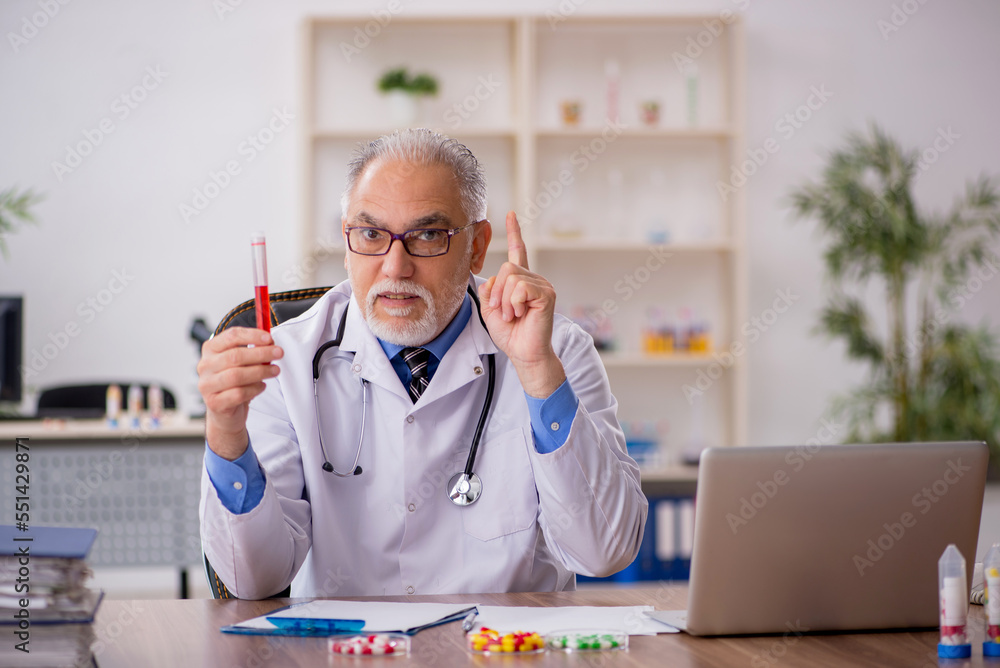 Old male doctor pharmacist in drugs synthesis concept Old male doctor pharmacist in drugs synthesis concept