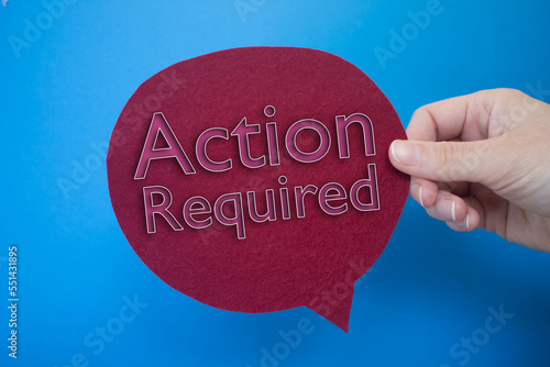 Speech bubble in front of colored background with Action Required text. photo