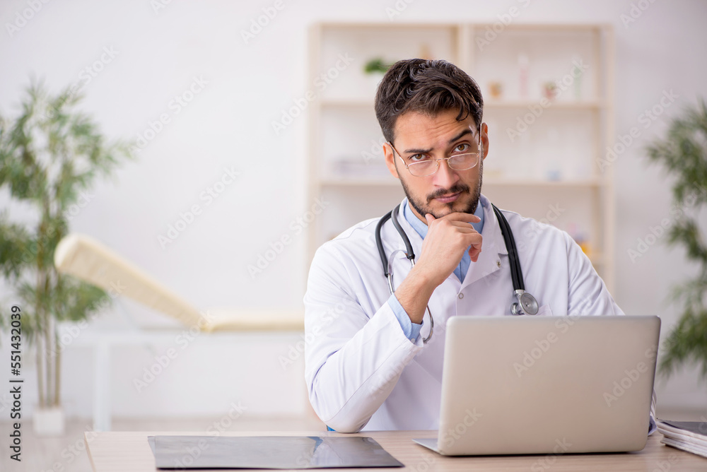Young male doctor in telemedicine concept Young male doctor in telemedicine concept