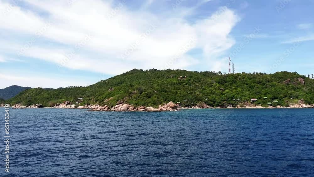 It looks like a drone shot close to the water, flying around the corner of an island. It looks like a drone shot close to the water, flying around the corner of an island.