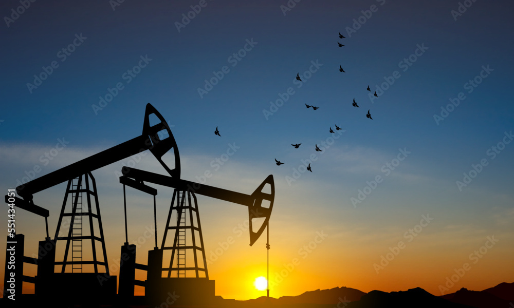 Silhouette of Oil pump. Industrial machine for petroleum on background of sunset Silhouette of Oil pump. Industrial machine for petroleum on background of sunset