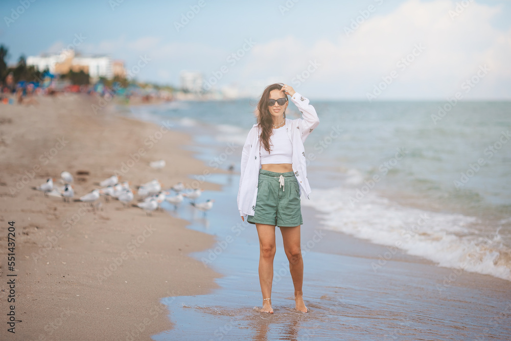 Young happy woman on the beach. 