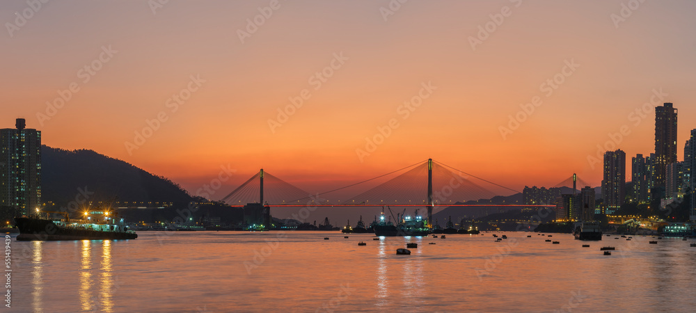 Panorama of idyllic landscape of harbor of Hong Kong city under sunset