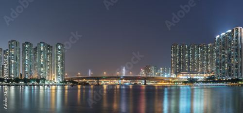 Panorama of harbor and skyline of Hong Kong city at night