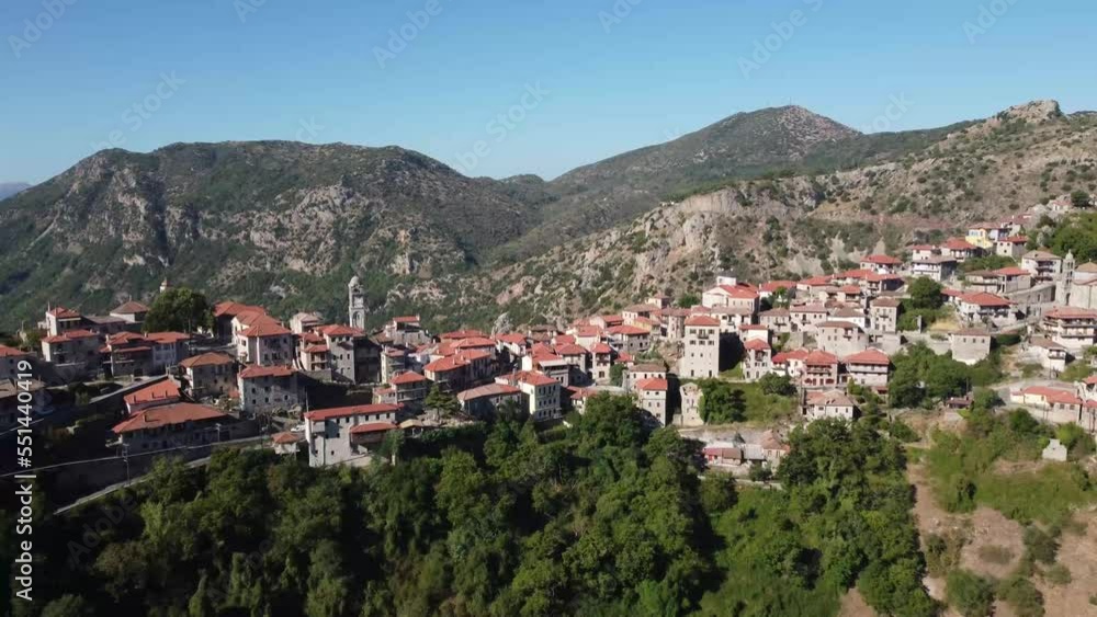 Aerial Arcadia Village on the mountain in Greece. Revealing scenic mountain view behind town. Aerial Arcadia Village on the mountain in Greece. Revealing scenic mountain view behind town.