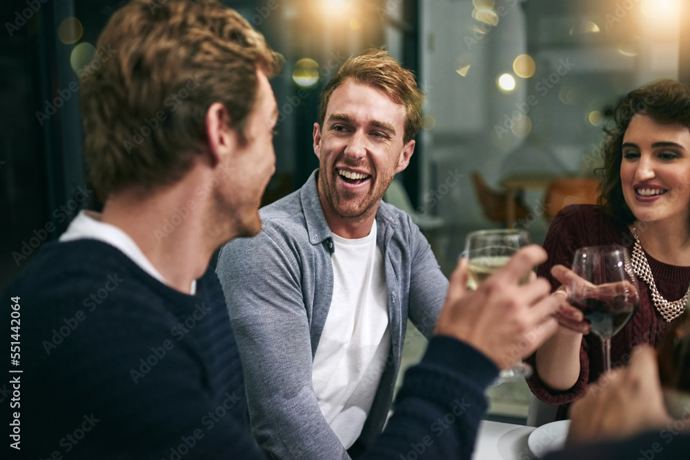 Laughing men, woman and wine glass toast in house, home or luxury restaurant for New Year, birthday party or celebration event. Smile, happy and bonding friends with alcohol drinks in success cheers