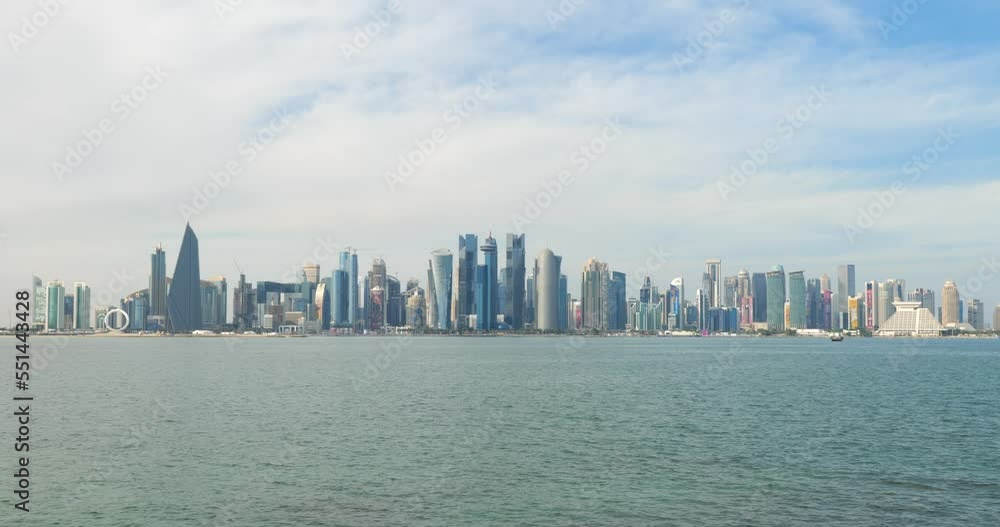 Doha skyline decorated with the football world cup branding with Dhow boats in foreground Doha skyline decorated with the football world cup branding with Dhow boats in foreground