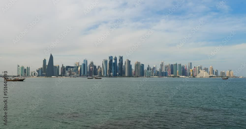 Doha skyline decorated with the football world cup branding with Dhow boats in foreground Doha skyline decorated with the football world cup branding with Dhow boats in foreground